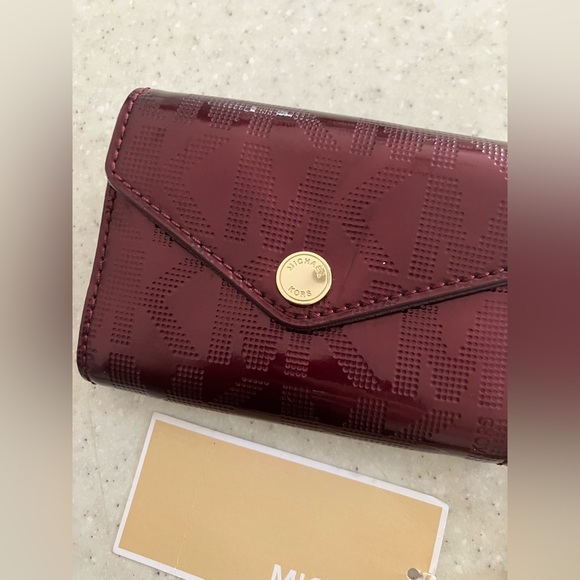 Michael Kors Handbags - Michael Kors Burgundy Patent MK Logo Envelope Wallet with Gold Accent